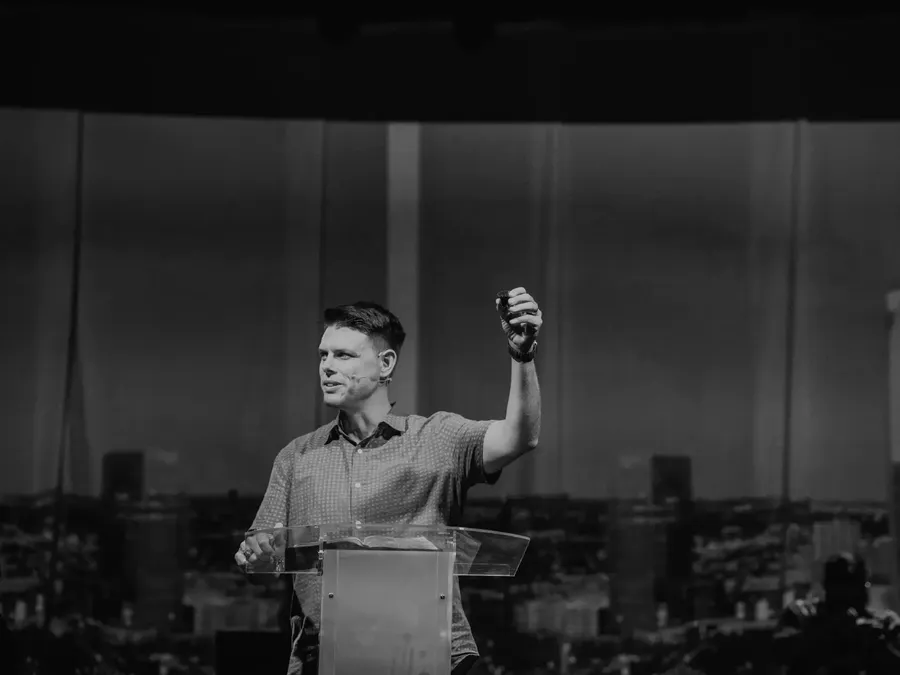 Michael Rowntree preaching with arm raised